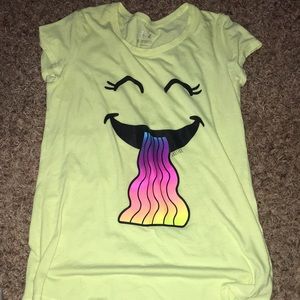 Yellow, short sleeve t-shirt with a face that’s throwing up rainbow